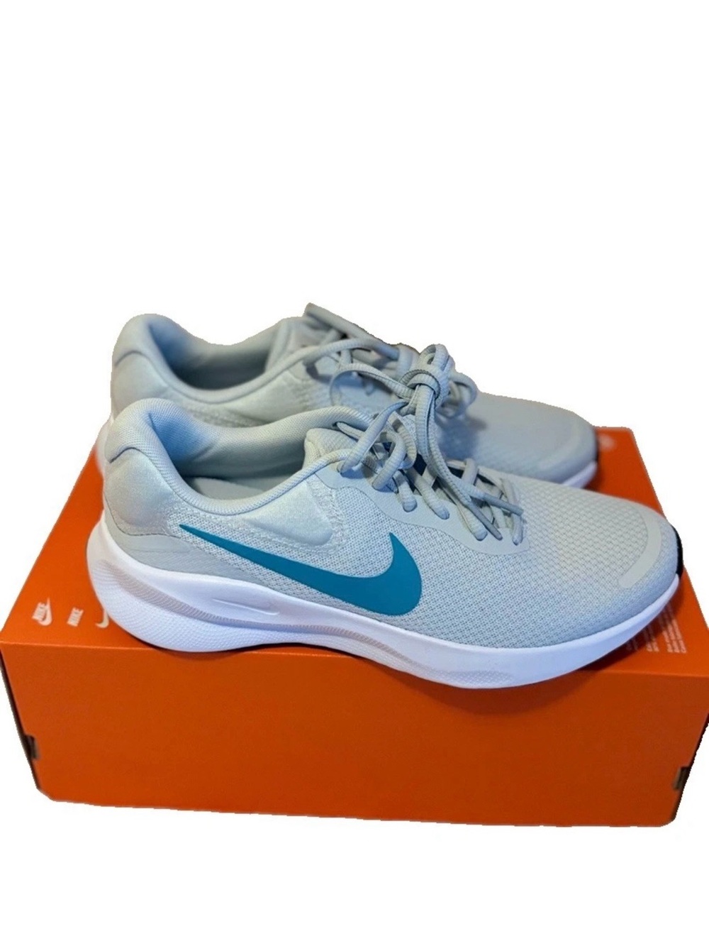 Nike women’s Revolution 7Light Gray Sneakers with Teal Swoosh